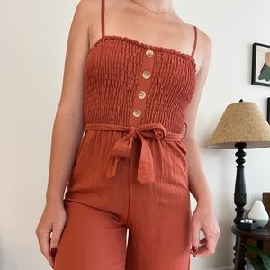 Spanish Boutique Jumpsuit with waist cinching tie in Burnt Orange / Rust